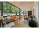 Relaxing back porch with wooden floors and comfortable seating for enjoying the outdoors at 2603 Stafford Ave # Apt C, Raleigh, NC 27607