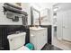 This bathroom features a vanity, a commode, and black wainscoting at 2603 Stafford Ave # Apt C, Raleigh, NC 27607