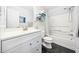 Bright bathroom featuring white cabinetry, modern fixtures, and a shower-tub combination at 2603 Stafford Ave # Apt C, Raleigh, NC 27607