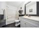 Bathroom features a shower-tub combination, and a framed mirror at 2603 Stafford Ave # Apt C, Raleigh, NC 27607