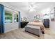 Bright bedroom features natural light, a ceiling fan, and ample storage with hardwood floors at 2603 Stafford Ave # Apt C, Raleigh, NC 27607