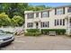 Inviting townhome with well-manicured landscaping, white trim, and a bench for relaxing at 2603 Stafford Ave # Apt C, Raleigh, NC 27607
