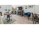 Bright living area featuring wood floors, fireplace, and plenty of natural light at 2603 Stafford Ave # Apt C, Raleigh, NC 27607