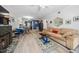 Open-concept living area with fireplace, wood floors, seamlessly connecting to the kitchen at 2603 Stafford Ave # Apt C, Raleigh, NC 27607