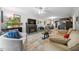 Cozy living room with a fireplace, neutral decor, and an open layout to the kitchen at 2603 Stafford Ave # Apt C, Raleigh, NC 27607