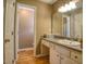Well-lit bathroom with a spacious countertop vanity and ample cabinet storage at 2817 Buckboard Ln, Raleigh, NC 27603