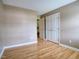 Bedroom featuring hardwood floors, double-door closet, and neutral paint at 2817 Buckboard Ln, Raleigh, NC 27603