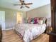 Cozy bedroom with a comfortable bed, ceiling fan and natural light at 2817 Buckboard Ln, Raleigh, NC 27603