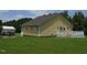 Exterior view of the home featuring a yellow-sided house and back deck at 2817 Buckboard Ln, Raleigh, NC 27603