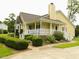 Charming home featuring a welcoming front porch, well-maintained landscaping, and a brick-paved walkway at 2817 Buckboard Ln, Raleigh, NC 27603