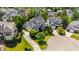 Aerial view of a beautiful house with lush green landscaping on a cul-de-sac in a residential area at 307 Beacon Falls Ct, Cary, NC 27519