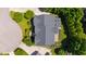 Overhead view of the house featuring a gray roof, mature landscaping, and a driveway leading to the street at 307 Beacon Falls Ct, Cary, NC 27519