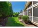 A serene backyard with lush greenery and a patio offers a peaceful escape from the city at 307 Beacon Falls Ct, Cary, NC 27519