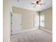 Bedroom featuring neutral walls, a ceiling fan, carpeted floor, and window at 307 Beacon Falls Ct, Cary, NC 27519