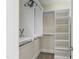 Walk-in closet featuring custom shelving for optimal organization at 307 Beacon Falls Ct, Cary, NC 27519