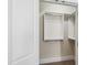 Walk-in closet with white shelving and rods, providing ample storage space at 307 Beacon Falls Ct, Cary, NC 27519