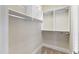 A close-up shot of an organized closet with multiple shelves and hanging rods at 307 Beacon Falls Ct, Cary, NC 27519