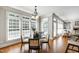 Dining area featuring hardwood floors, lots of light, chandelier, and contemporary decor at 307 Beacon Falls Ct, Cary, NC 27519