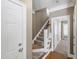 Hallway with carpeted stairs and white trim, leading to the upper level of the home at 307 Beacon Falls Ct, Cary, NC 27519