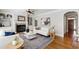 Cozy living room featuring hardwood floors, a fireplace, neutral decor, and natural light at 307 Beacon Falls Ct, Cary, NC 27519