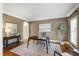 Stylish office with a sleek black desk, neutral walls, and ample natural light at 307 Beacon Falls Ct, Cary, NC 27519