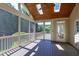 This covered patio with skylights and a fan provides plenty of natural light and air circulation at 307 Beacon Falls Ct, Cary, NC 27519