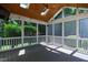 The covered patio has a ceiling fan and screens to keep insects away, providing an indoor/outdoor living experience at 307 Beacon Falls Ct, Cary, NC 27519