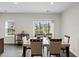 A cozy dining area with a neutral color palette, offering peaceful views of the property at 333 Amber Acorn Ave, Raleigh, NC 27603