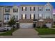 Charming townhome with brick facade, attached garage, and well-maintained landscaping at 333 Amber Acorn Ave, Raleigh, NC 27603