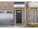 Close up of the front door, garage door and brick facade at 333 Amber Acorn Ave, Raleigh, NC 27603