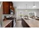Spacious kitchen with granite counters, island sink, and stainless steel stove at 333 Amber Acorn Ave, Raleigh, NC 27603
