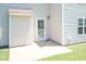 Exterior features a covered patio and secure white-framed door with a white security screen door at 4125 Scofield Dr, Raleigh, NC 27610