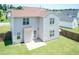 Aerial of the house showing a well maintained lawn, wooden fence and concrete patio at 4125 Scofield Dr, Raleigh, NC 27610
