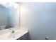 Bathroom featuring single vanity, a mirror, and bright lighting fixtures at 4125 Scofield Dr, Raleigh, NC 27610
