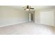 Spacious bedroom with neutral carpet, a closet, and a doorway leading to another room at 4125 Scofield Dr, Raleigh, NC 27610