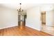 View of open-concept dining area with hardwood floors and natural light at 4125 Scofield Dr, Raleigh, NC 27610
