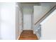 Inviting foyer with wood floors, neutral paint, and a staircase leading to the upper level at 4125 Scofield Dr, Raleigh, NC 27610