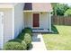 Charming front entrance with a red door, neat shrubbery, and a well-maintained walkway at 4125 Scofield Dr, Raleigh, NC 27610