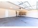 Spacious two-car garage with ample lighting and storage shelving at 4125 Scofield Dr, Raleigh, NC 27610