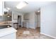 Spacious kitchen with stainless steel appliances and tile floors at 4125 Scofield Dr, Raleigh, NC 27610