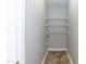 Small laundry room with shelves at 4125 Scofield Dr, Raleigh, NC 27610