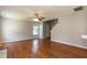 Spacious living room with hardwood floors, neutral paint, and a ceiling fan at 4125 Scofield Dr, Raleigh, NC 27610
