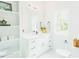 Bathroom features built-in shelves, white vanity, black faucet, and toilet at 415 E Lavender Ave, Durham, NC 27704