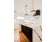 Modern kitchen with a large island, marble countertops, and stylish pendant lighting at 415 E Lavender Ave, Durham, NC 27704