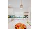 Spacious kitchen with white cabinets, farmhouse sink, stylish pendant lighting, and a large center island at 415 E Lavender Ave, Durham, NC 27704
