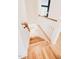 Bright staircase features wood treads, white risers, and wooden handrail at 415 E Lavender Ave, Durham, NC 27704
