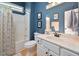 Bathroom with tub-shower combo and vanity with granite countertop at 4219 Peachway Dr, Durham, NC 27705