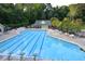 Large community pool featuring lap lanes, ample seating, and a shaded pavilion at 4219 Peachway Dr, Durham, NC 27705