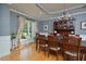 Elegant dining room featuring hardwood floors, large window and a stylish chandelier at 4219 Peachway Dr, Durham, NC 27705