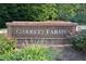 Garrett Farms entrance sign with brick base and decorative landscaping at 4219 Peachway Dr, Durham, NC 27705